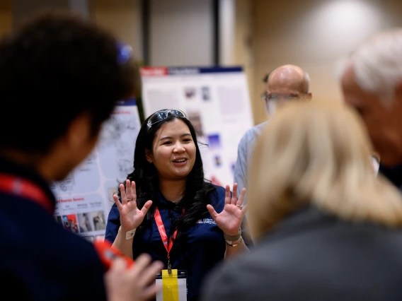 a student presents to judges at Design Day