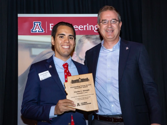 Stemple and Hahn pose with an award plaque