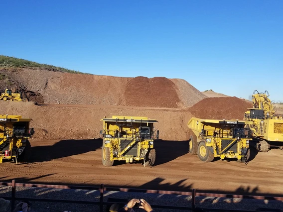 Image of autonomous trucks  during a demonstration at Caterpillar’s Mining Technology Demonstration & Program