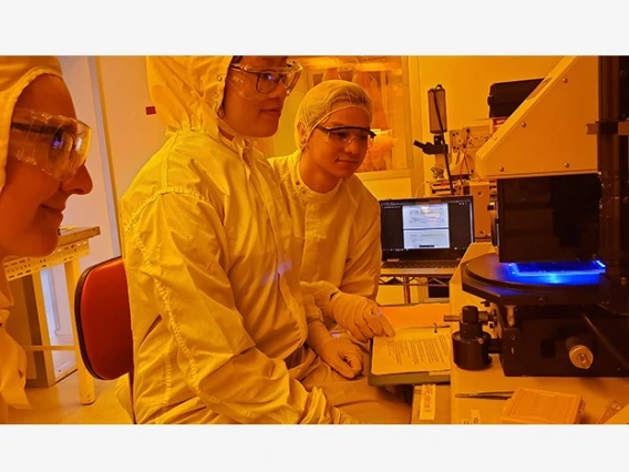 3 students in a lab setting