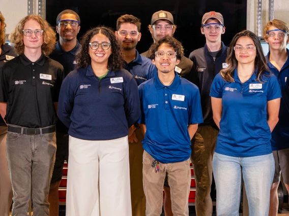 a large group of people in a makerspace