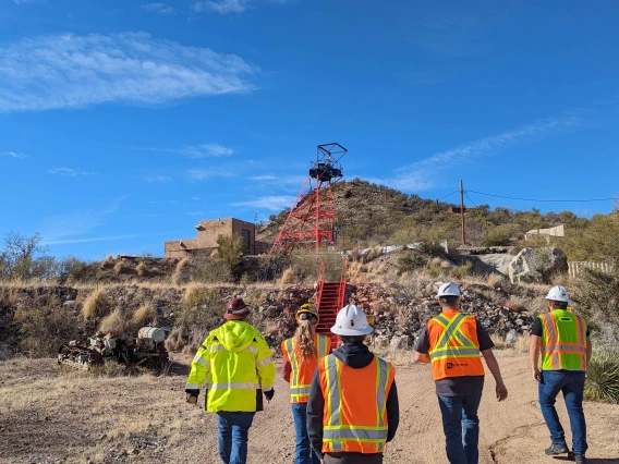 5 students outdoors at a mining site