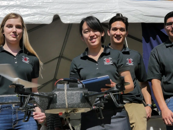 Members of Team 16003 demonstrate their anti-drone device during Engineering Design Day 2017