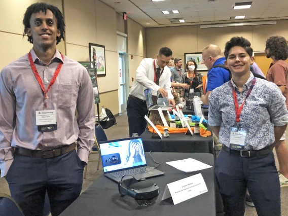 two people at a conference booth