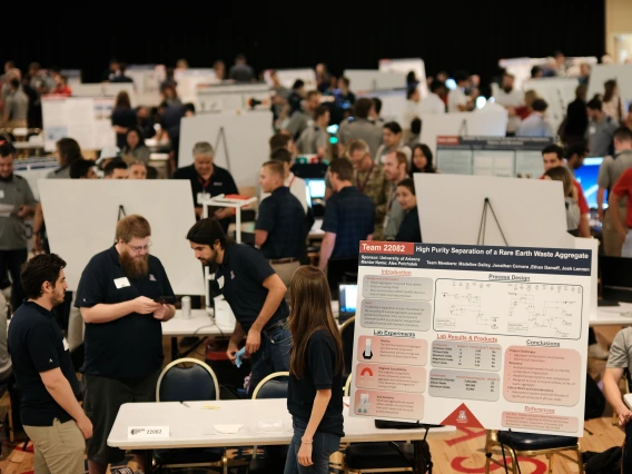 students and scientific posters at a large-scale event