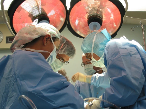 physicians perform surgery