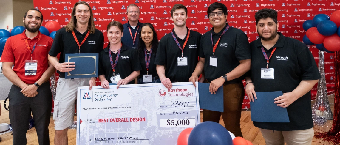 Stemple and a student team with a large winners' check