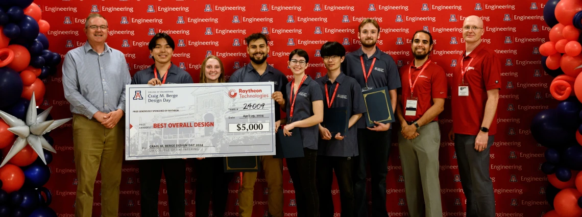 Stemple and a student team with a large winners' check