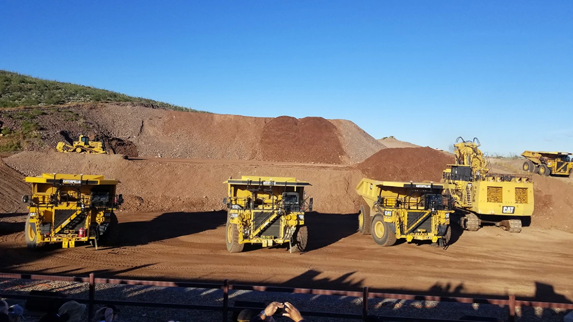 Image of autonomous trucks  during a demonstration at Caterpillar’s Mining Technology Demonstration & Program