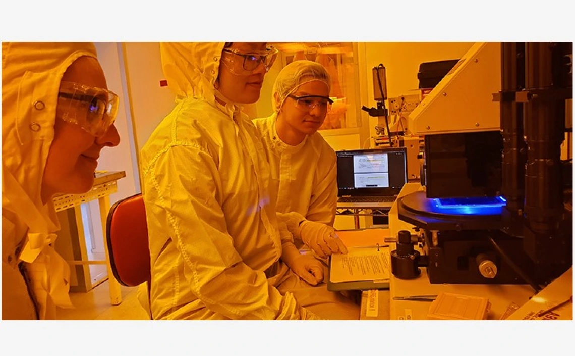 3 students in a lab setting