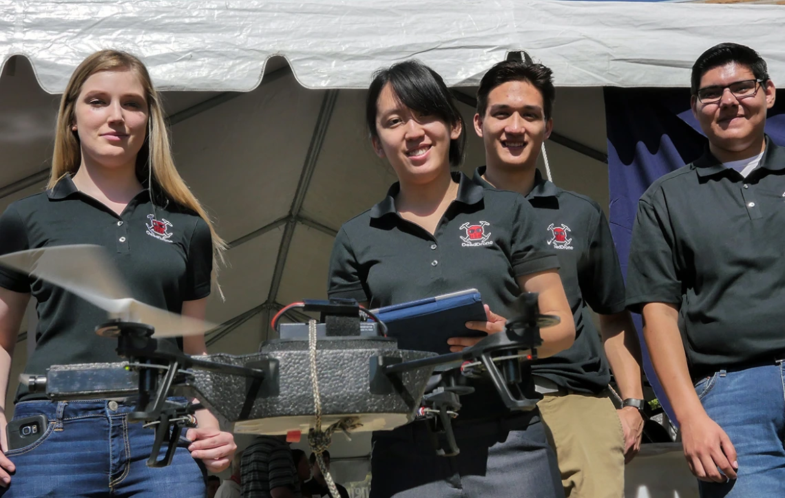 Members of Team 16003 demonstrate their anti-drone device during Engineering Design Day 2017