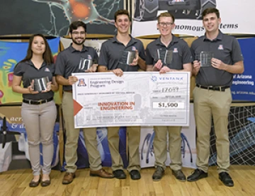 University students with a large award check