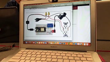 Laptop computer screen showing a diagram with electronic components