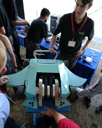 a student wtih a battle robot