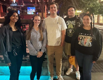 a group of students posing outdoors