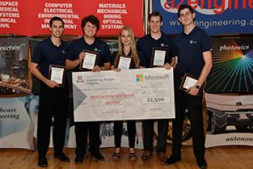 University students with a large award check