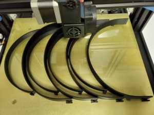 Image of face shields after being produced by a 3D printer