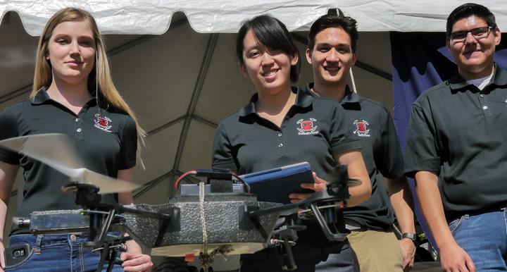 Members of Team 16003 demonstrate their anti-drone device during Engineering Design Day 2017